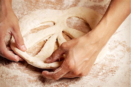 Preparing a Fougasse with the bread dough Stock Photo - Premium Royalty-Free, Code: 652-07655764