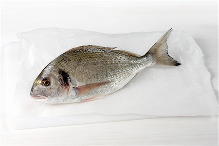 fish food cooking - Raw sea bream Stock Photo - Premium Royalty-Free, Code: 652-07656177