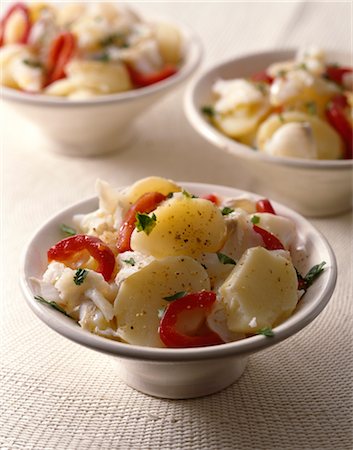 plated food - Fish,pepper and potato salad Stock Photo - Premium Royalty-Free, Code: 652-03634943