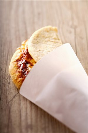 paper rolls - Folded pizza in a paper cone Stock Photo - Premium Royalty-Free, Code: 652-03802898