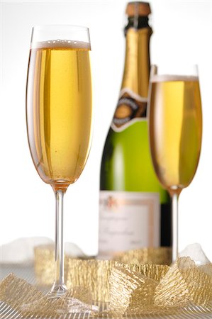 simsearch:825-05985931,k - Glasses and bottle of Champagne Stock Photo - Premium Royalty-Free, Code: 652-03802938