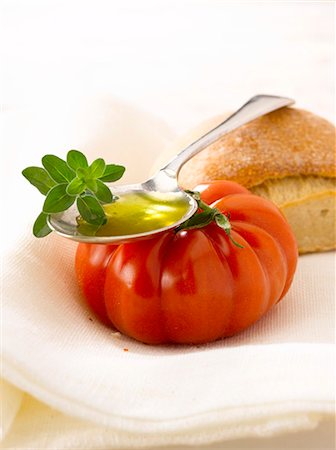 Bread,tomato,oilve oil and fresh oregano Stock Photo - Premium Royalty-Free, Code: 652-03803358