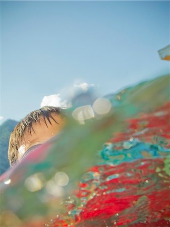 Boy coming up out of water Stock Photo - Premium Royalty-Free, Code: 673-06025467