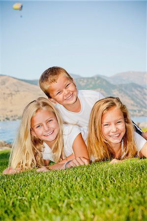 Outdoor portrait of three young children Stock Photo - Premium Royalty-Free, Code: 673-06025462