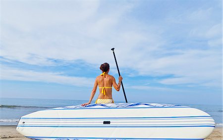simsearch:673-06964643,k - Woman on beach with paddle board Stock Photo - Premium Royalty-Free, Code: 673-06964485