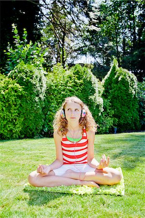 Teen girl meditating outdoors Stock Photo - Premium Royalty-Free, Code: 673-06964685