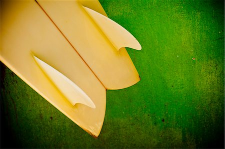 surfboard close up - Close up of a yellow twin fin swallowtail surfboard Stock Photo - Premium Royalty-Free, Code: 673-08139242