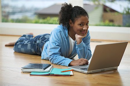 Teenage girl working on a laptop computer. Stock Photo - Premium Royalty-Free, Code: 673-02137748