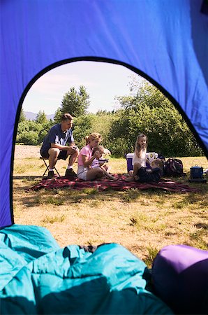 simsearch:673-02138237,k - Family relaxing at a campsite. Stock Photo - Premium Royalty-Free, Code: 673-02137804