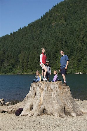 simsearch:673-02138237,k - Family posing on a big tree stump. Stock Photo - Premium Royalty-Free, Code: 673-02137820