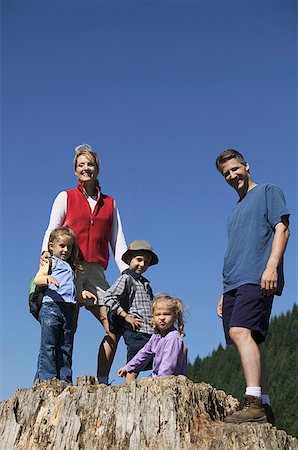 simsearch:673-02138237,k - Family posing on a big tree stump. Stock Photo - Premium Royalty-Free, Code: 673-02137821