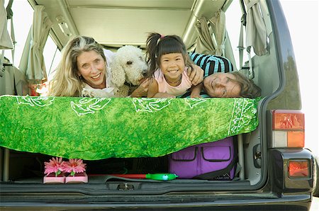 Parents, daughter and their dog in a van. Stock Photo - Premium Royalty-Free, Code: 673-02138027