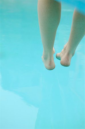 A pair of legs and feet underwater. Stock Photo - Premium Royalty-Free, Code: 673-02138207