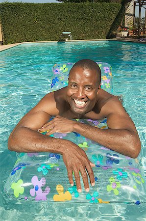 simsearch:673-02138072,k - Man floating in a swimming pool. Stock Photo - Premium Royalty-Free, Code: 673-02138208