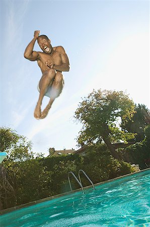 simsearch:673-02138072,k - Man leaping into a swimming pool. Stock Photo - Premium Royalty-Free, Code: 673-02138214