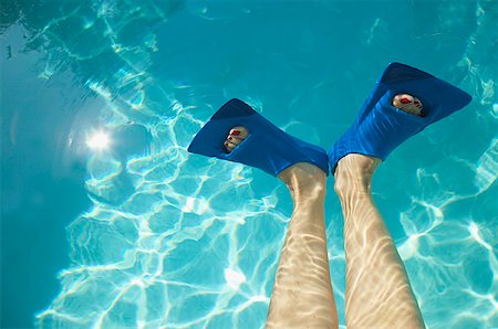 Overhead view of feet in swim fins. Stock Photo - Premium Royalty-Free, Code: 673-02138226