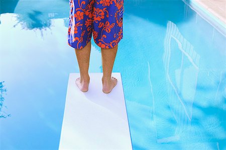 diving board - Man's legs on a diving board. Stock Photo - Premium Royalty-Free, Code: 673-02138234