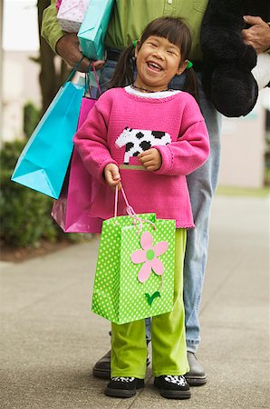 simsearch:673-02138237,k - A young girl shopping with her father. Stock Photo - Premium Royalty-Free, Code: 673-02138286