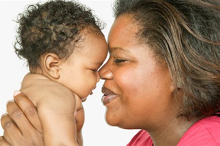 person rubbing nose - A mom snuggling with her baby girl. Stock Photo - Premium Royalty-Free, Code: 673-02138334