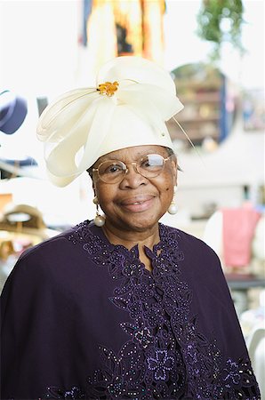 finery - Portrait of a senior woman wearing a fancy white hat. Stock Photo - Premium Royalty-Free, Code: 673-02138499