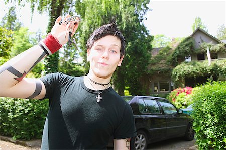 A young, punky man with car keys Stock Photo - Premium Royalty-Free, Code: 673-02138684