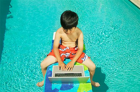 simsearch:673-02139140,k - Youngster working on his laptop at poolside Stock Photo - Premium Royalty-Free, Code: 673-02138714