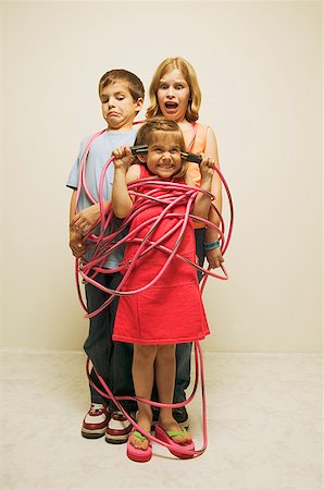 Three totally wired children Stock Photo - Premium Royalty-Free, Code: 673-02138737