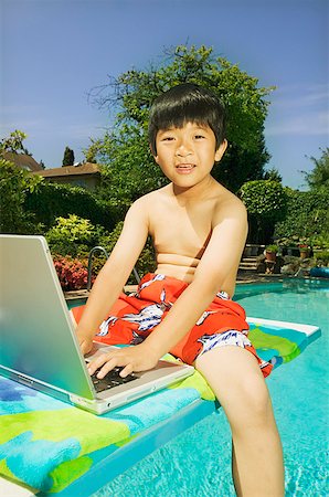 simsearch:673-02139140,k - A boy sitting on a diving board with his laptop Stock Photo - Premium Royalty-Free, Code: 673-02138748