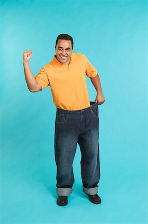 Man wearing pants that are too large Stock Photo - Premium Royalty-Free, Code: 673-02138799
