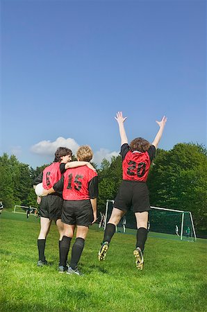 pumped up - Three female soccer players celebrate a win Stock Photo - Premium Royalty-Free, Code: 673-02138861