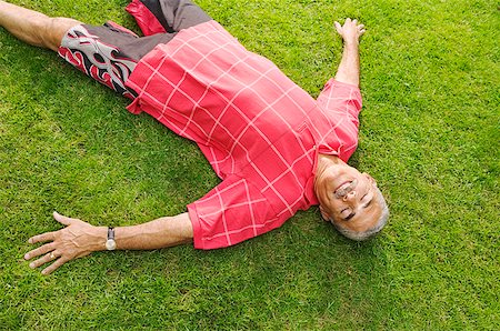 A man lying on his lawn Stock Photo - Premium Royalty-Free, Code: 673-02138929