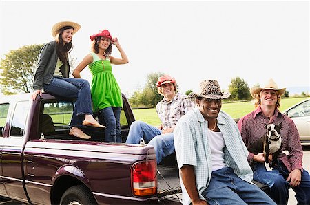 simsearch:673-02138072,k - People hanging out in the back of a pick up truck Stock Photo - Premium Royalty-Free, Code: 673-02139021