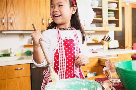 A young girl cooking Stock Photo - Premium Royalty-Free, Code: 673-02139080