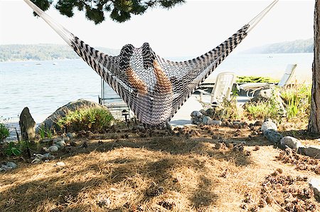 simsearch:673-02139140,k - Boy relaxing in a hammock at the shore Stock Photo - Premium Royalty-Free, Code: 673-02139126