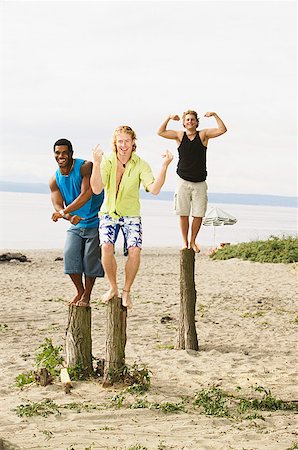 simsearch:673-02139140,k - Men flexing their muscles at the beach Stock Photo - Premium Royalty-Free, Code: 673-02139128