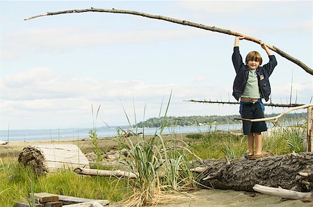 simsearch:673-02139140,k - Boy playing on a log at the beach Stock Photo - Premium Royalty-Free, Code: 673-02139157