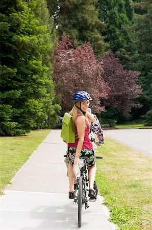 Couple riding tandem bicycle Stock Photo - Premium Royalty-Free, Code: 673-02139416
