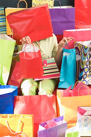 enigma - Woman surrounded by shopping bags Stock Photo - Premium Royalty-Free, Code: 673-02139450