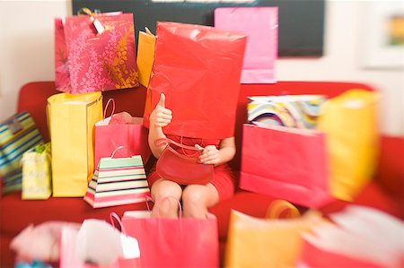 shopaholic - Woman surrounded by shopping bags Foto de stock - Sin royalties Premium, Código: 673-02139477