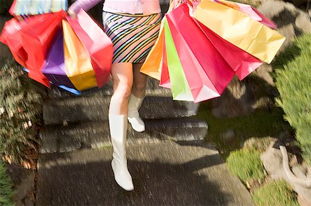 enigma - Woman carrying several shopping bags Stock Photo - Premium Royalty-Free, Code: 673-02139492