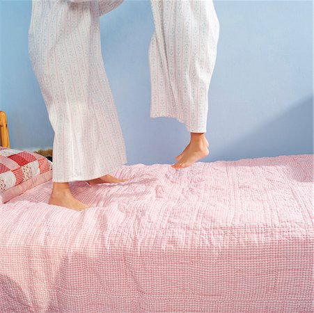 Girls jumping on bed Stock Photo - Premium Royalty-Free, Code: 673-02139550