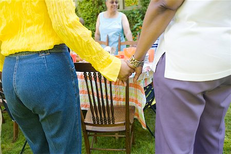 simsearch:673-02139604,k - Women holding hands at picnic Stock Photo - Premium Royalty-Free, Code: 673-02139603