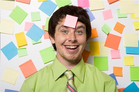 Portrait of office worker with sticky notes Stock Photo - Premium Royalty-Free, Code: 673-02139654