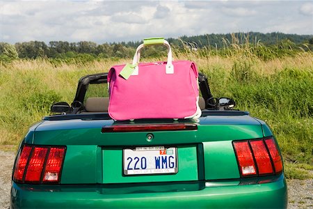 Still life of pink tote bag and car Stock Photo - Premium Royalty-Free, Code: 673-02139716