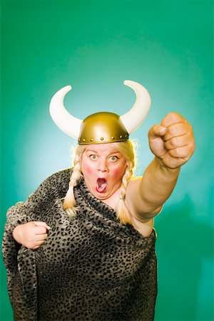 people opera - Powerful woman with upraised fist Stock Photo - Premium Royalty-Free, Code: 673-02139831