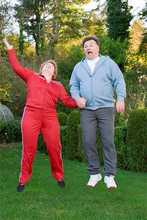 fat man exercising - Middle aged couple jumping outdoors Stock Photo - Premium Royalty-Free, Code: 673-02140419