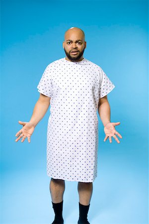 surprised black people - Male patient in gown Stock Photo - Premium Royalty-Free, Code: 673-02140993