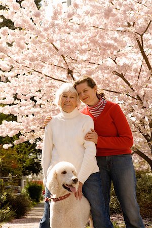 Portrait of woman with grown daughter and dog Stock Photo - Premium Royalty-Free, Code: 673-02141055