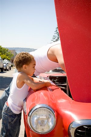 solicitous - Father and son checking under car hood Stock Photo - Premium Royalty-Free, Code: 673-02141444
