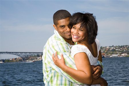 Couple hugging by bay Stock Photo - Premium Royalty-Free, Code: 673-02141743